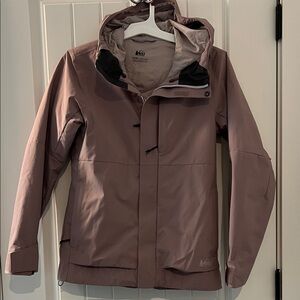 Women’s REI ski coat. Minimal wear and tear. Greyish pink.
